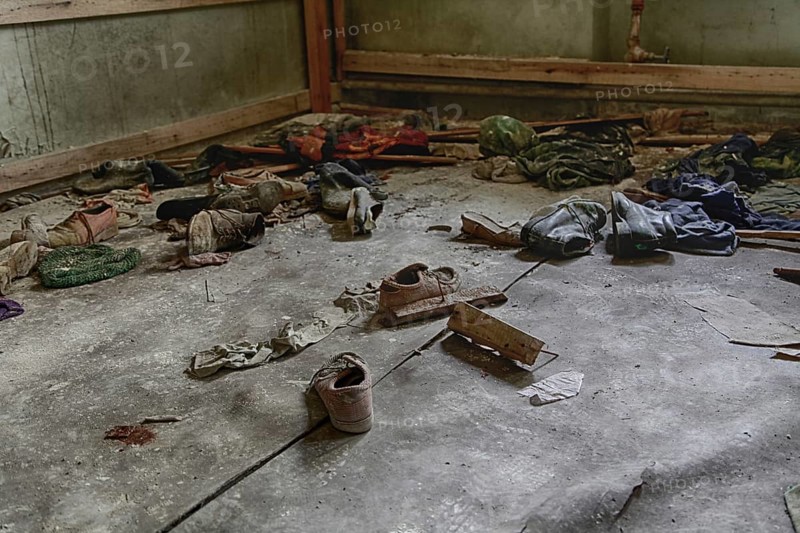 Various shoes and clothes on the ground