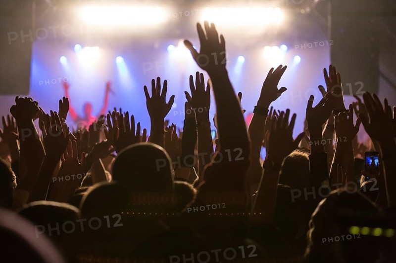 Fans in the audience cheering during the concert of the German-Lebanese rapper MoTrip live at the Schuur