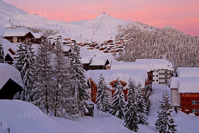 Village view snow-covered at dusk