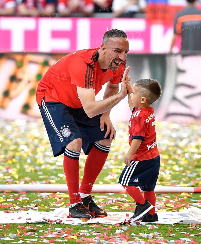 Soccer player Franck Ribery FC Bayern Munich claps off with son Salif