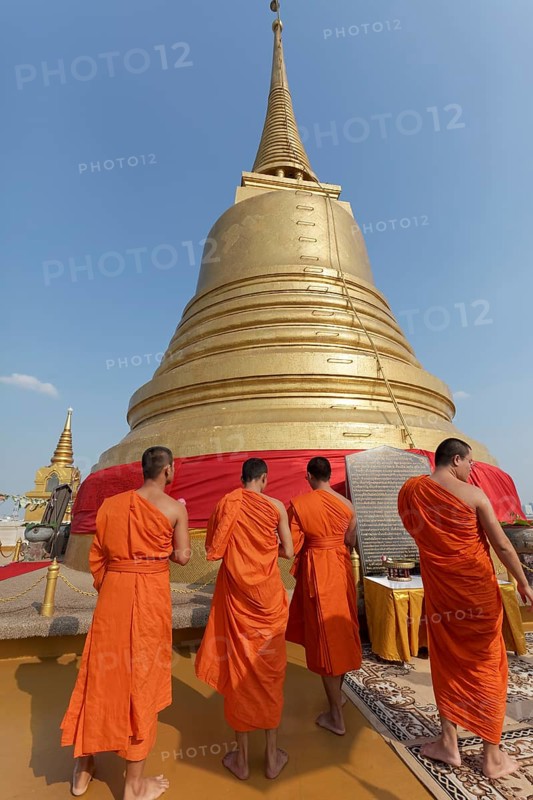 Buddhist monks in front of the Chedi on Phu Khao Thong