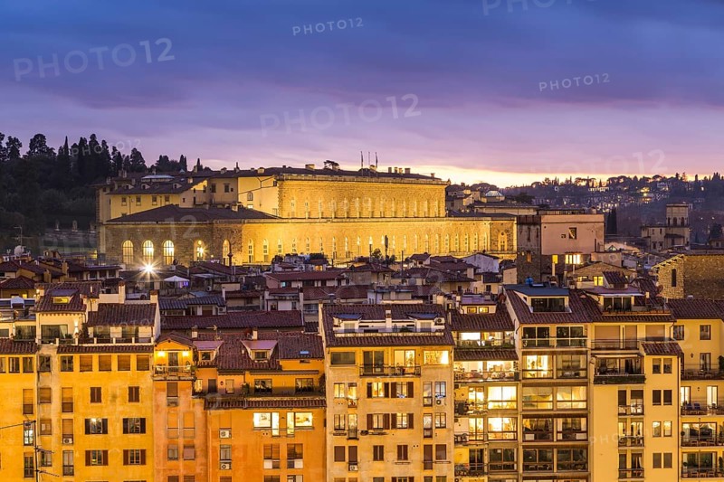 View of residential buildings and Palazzo Pitti at dusk