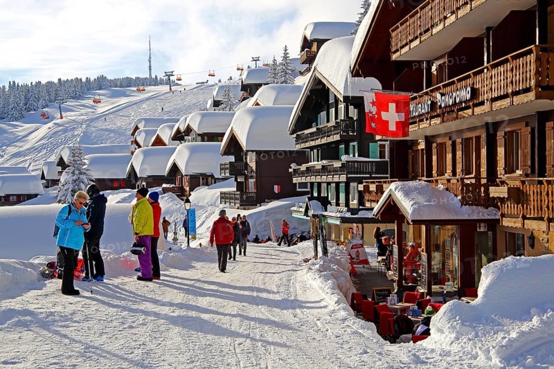 Village road with snow-covered houses