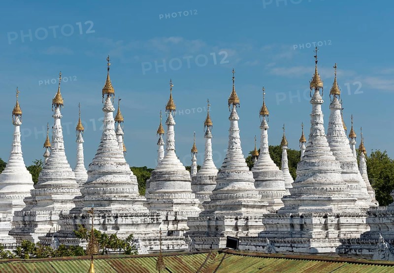 Row of white stupas at Sandamuni Pagoda
