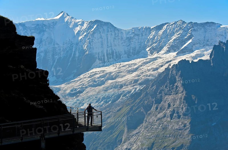 Tourist on the First Cliff Walk by Tissot in front of the Fiescherhorn north face and the Grindelwald glacier