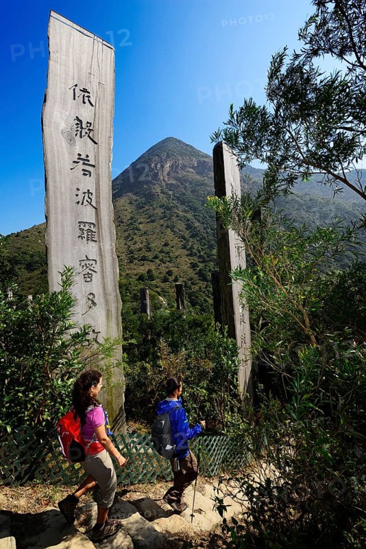 Hikers in front of wooden stelae at Wisdom Path