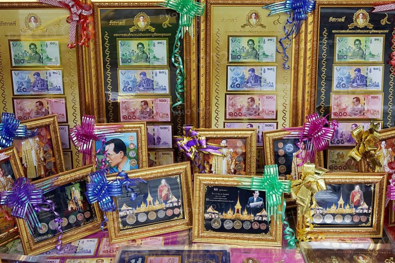 Former King Bhumibol Adulyadej on banknotes and coins