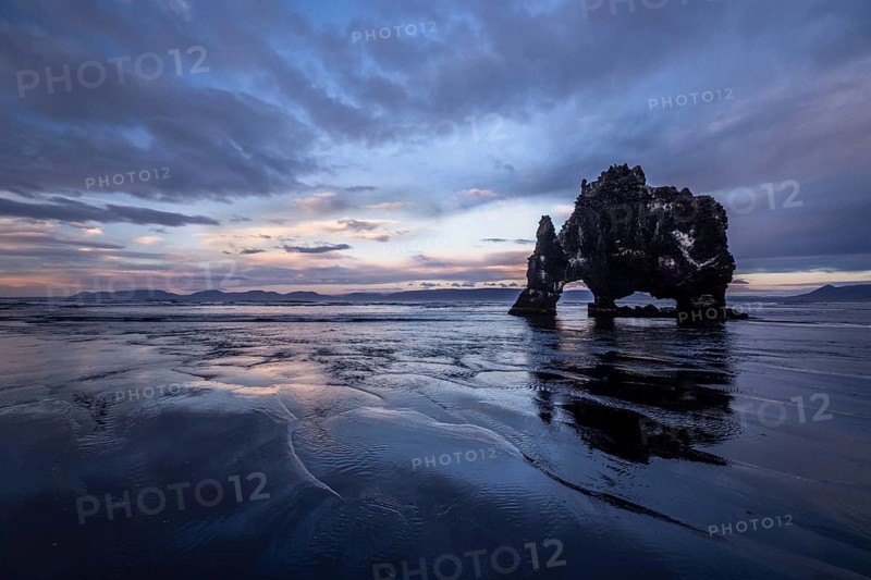 Cloudy atmosphere with reflection at Hvitserkur