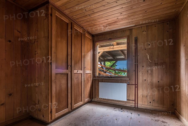 A room paneled with wood in a house that will be demolished
