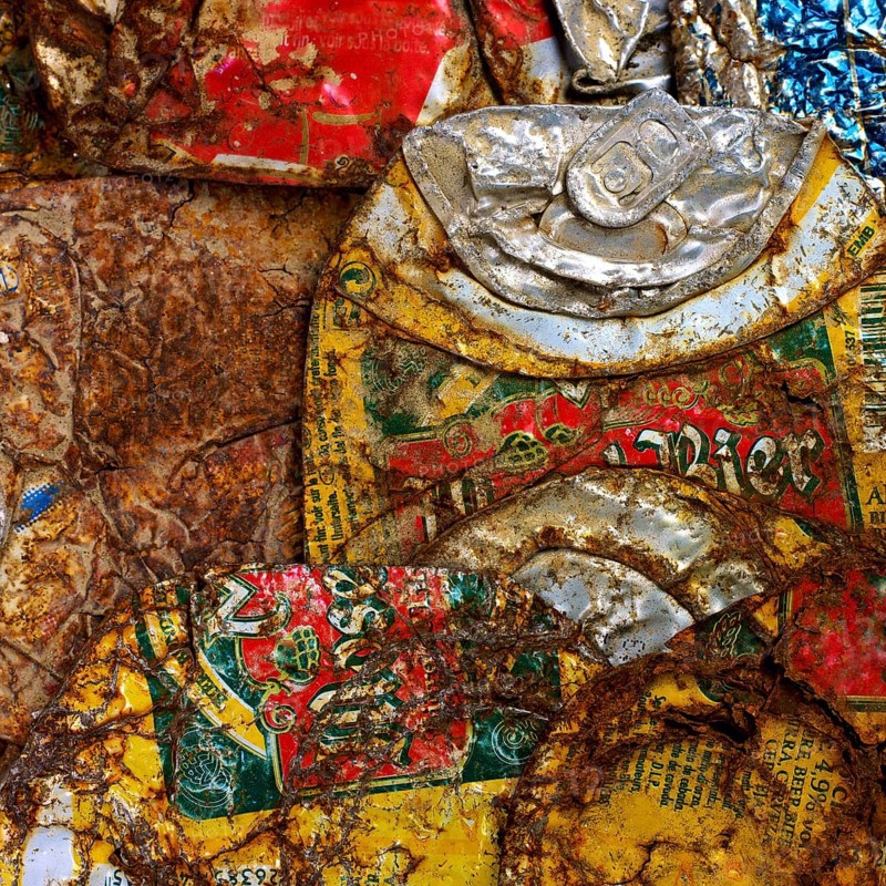 Stack of rusty and used metal beer cans
