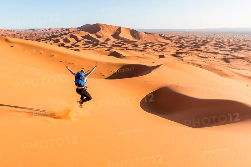 Woman running downhill