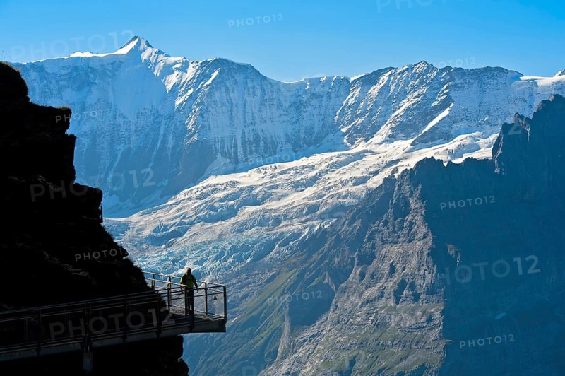 Tourist on the First Cliff Walk by Tissot in front of the Fiescherhorn north face and the Grindelwald glacier