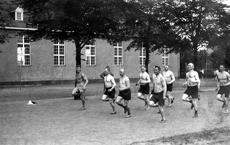Men jogging with naked torsos
