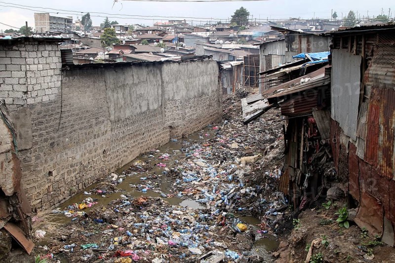 Garbage between corrugated-iron huts