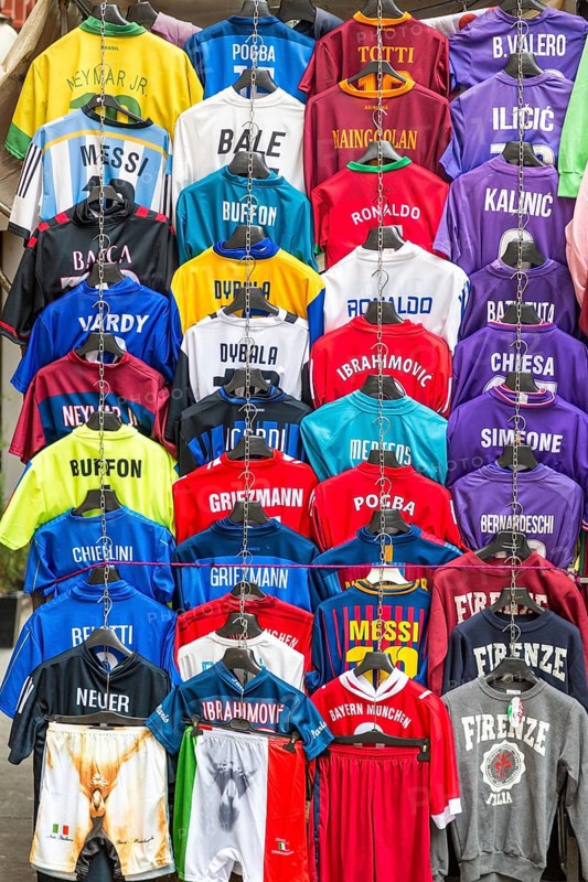 Football jerseys with names of football players for sale at sales stall