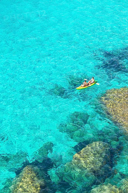 People canoeing at Cala Mitjana