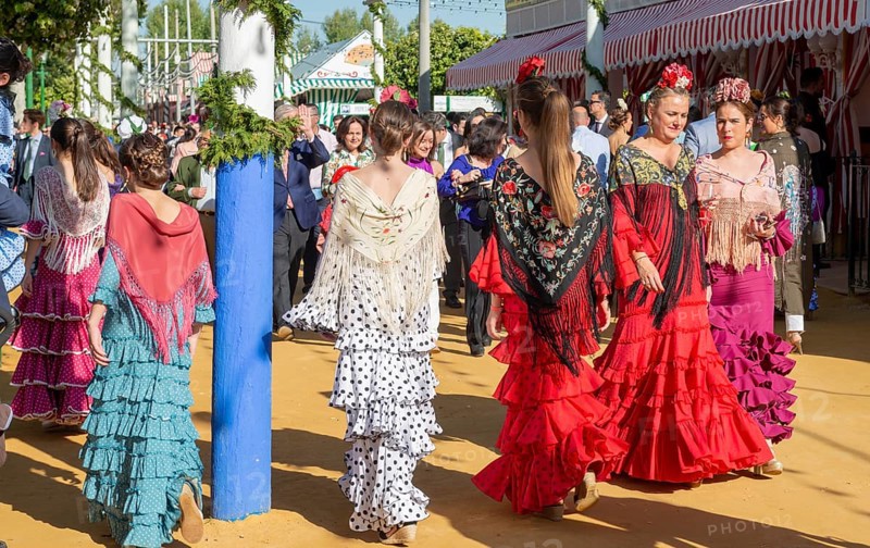 Spanish women with colorful flamenco dresses