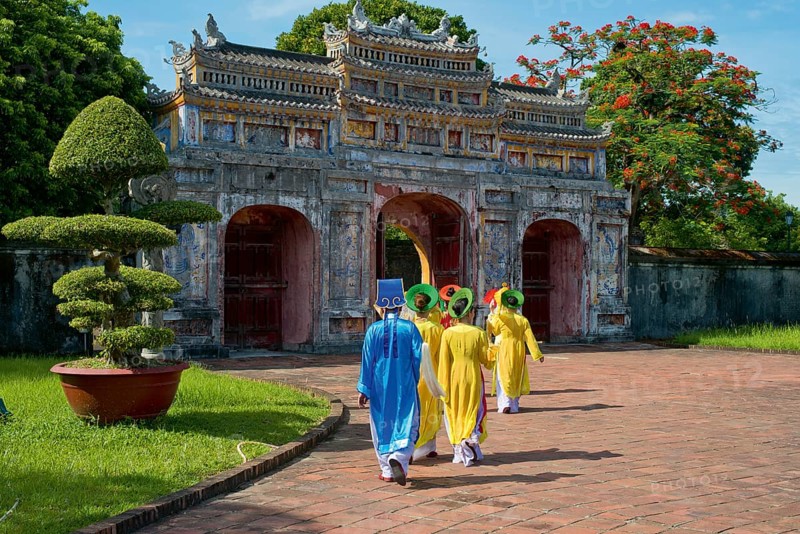 Vietnamese extras walk through West Gate