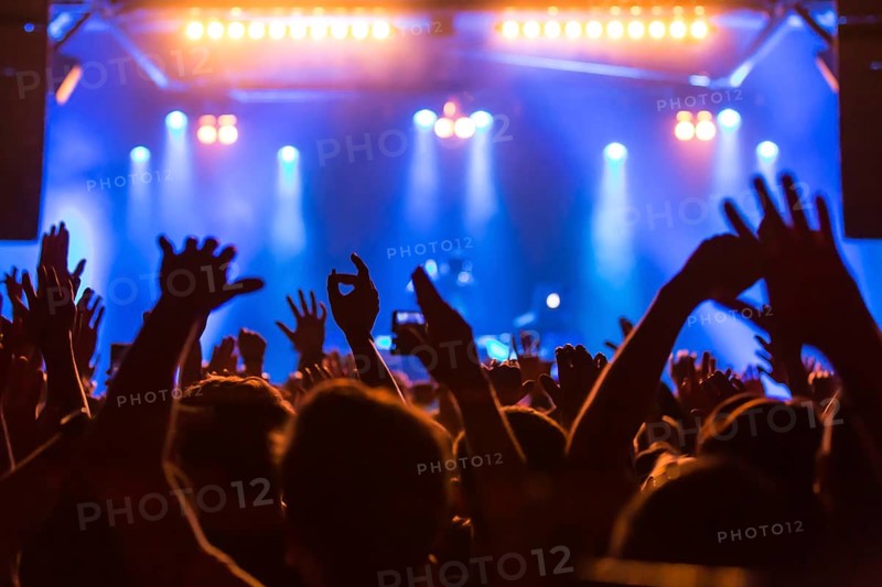 Fans in the audience cheering during the concert of the German-Lebanese rapper MoTrip live at the Schuur