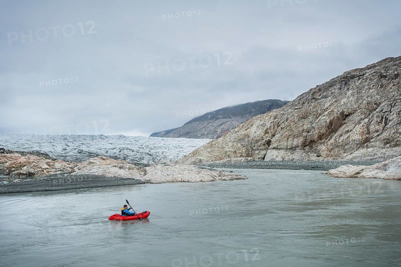 Man with Packraft on river