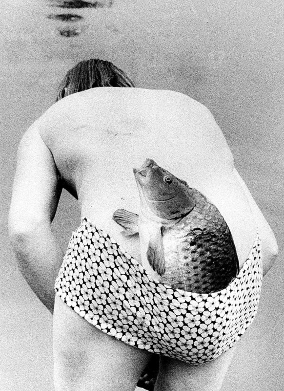 Man with fish in swimsuit ca. 1970s