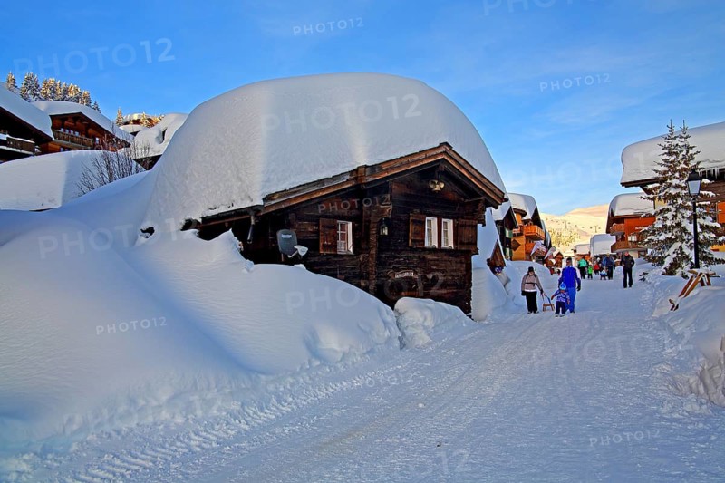 Village road with snow-covered chalets