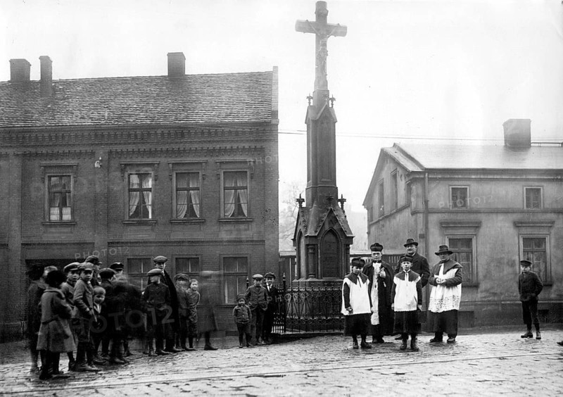 Village square with priest and altar boy ca. 1930