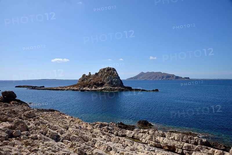 Il Faraglione rocky island with Favignana Island in the back