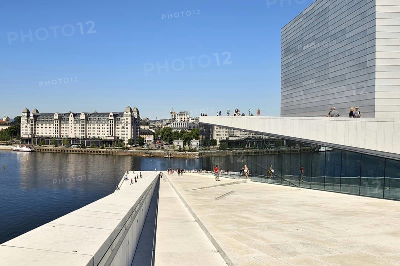 Forecourt and walk-in roof of the new white marble opera house in the back old warehouse district with harbour warehouse