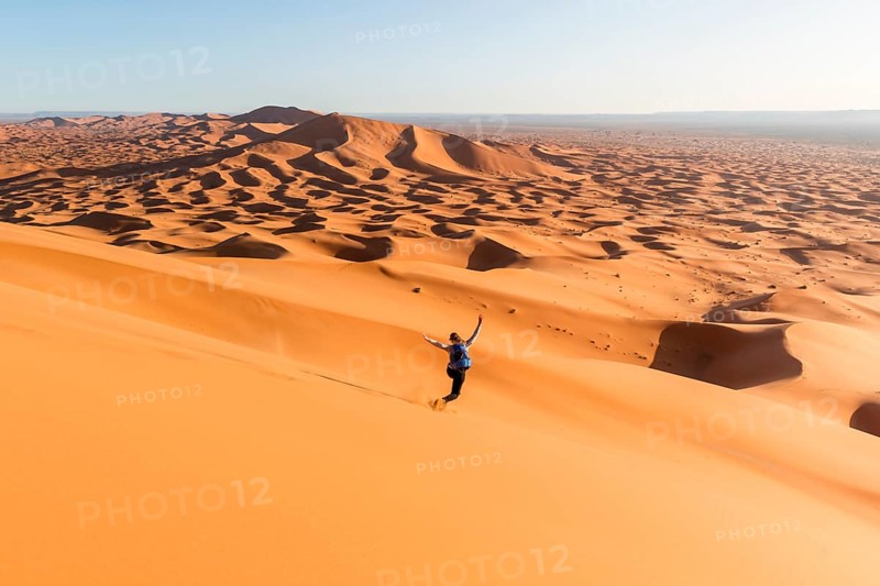 Woman running downhill