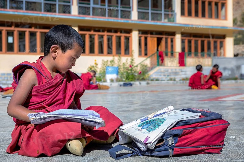 A small school boy studding outside at Likir Monastery or Likir Gompa