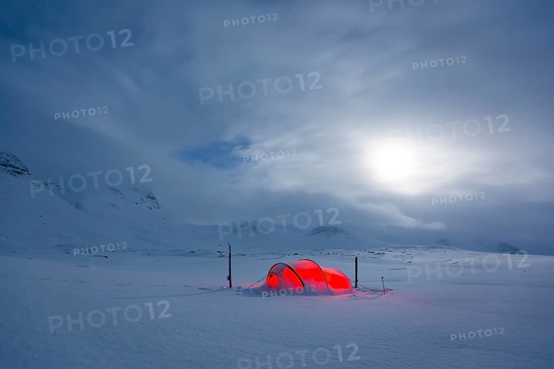Tent by full moon in the snow