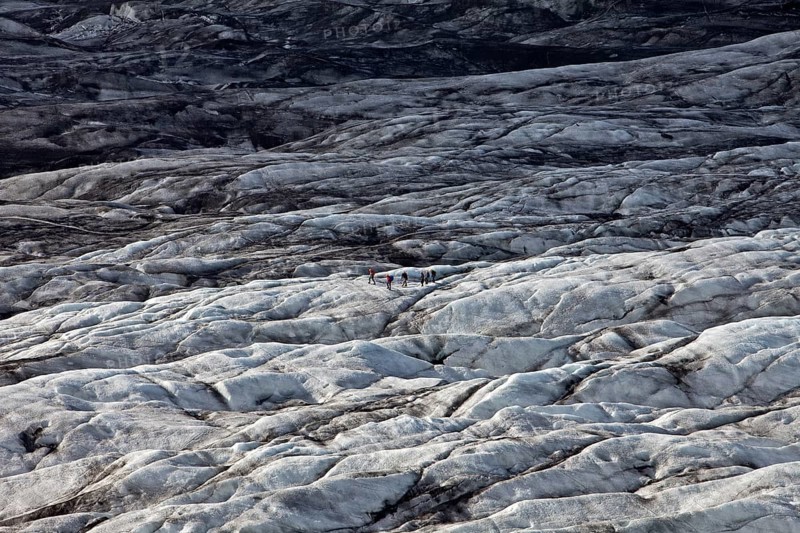 People on the glacier tongue of Svinafellsjokull in Vatnajokull National Park