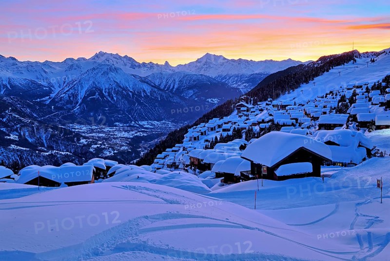 View of the snow-covered village overlooking the Rhone valley towards Dom 4545m