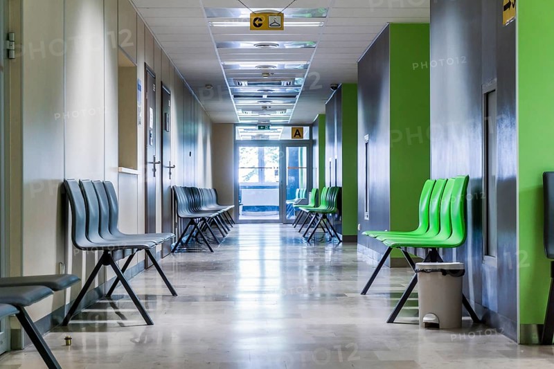 Corridor with chairs for patients in a modern hospital