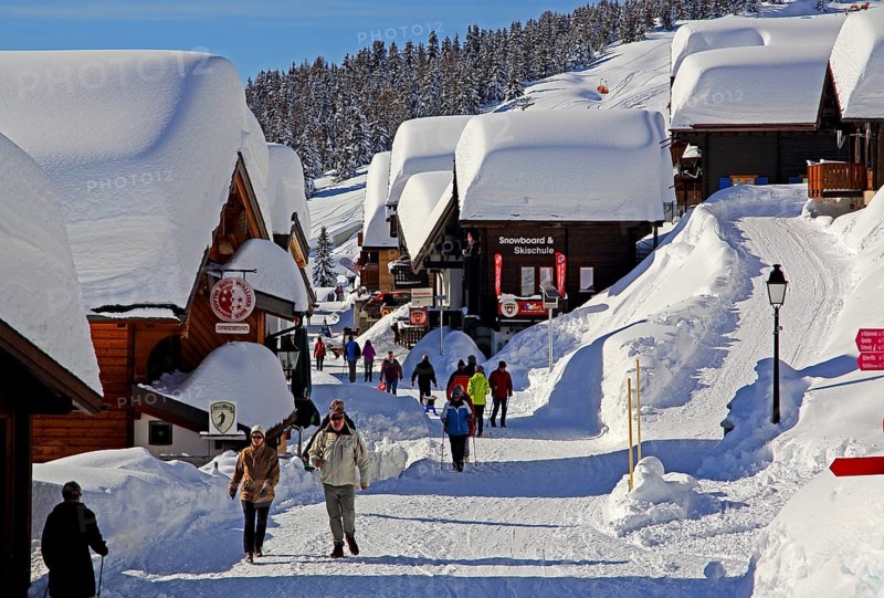 Village road with snow-covered chalets
