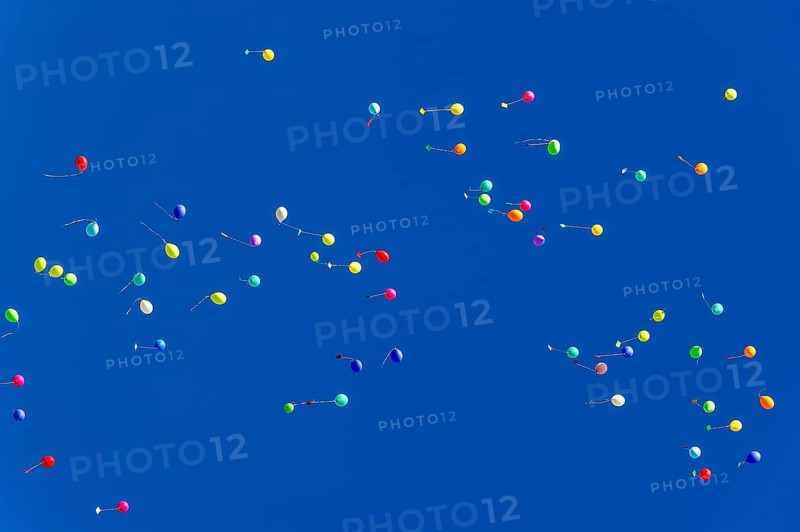 Colorful balloons rise to the sky