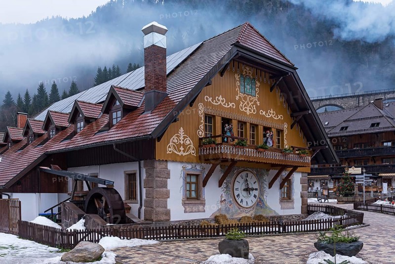 Old Black Forest house with fan painting and large wall clock