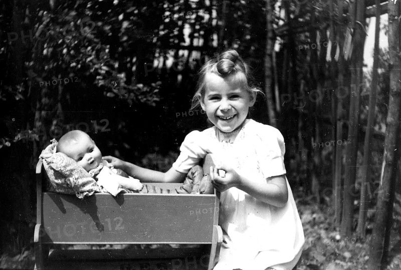 Girl playing with baby doll