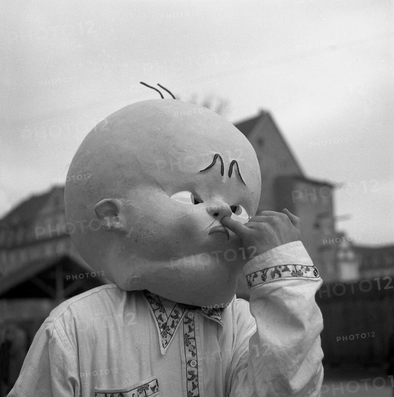 Man with huge baby mask