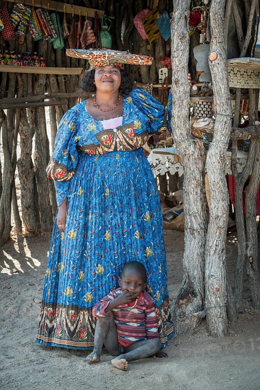 Native Herero woman with typical headgear and clothes and child