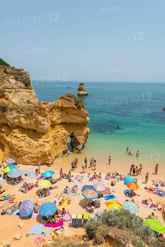 Tourists and bathers at the sandy beach