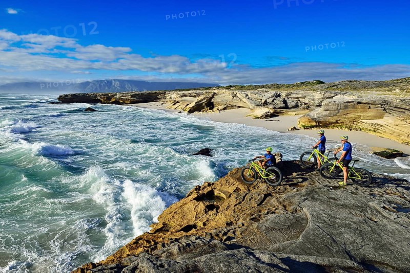 Mountain bikers with Fatbikes on cliff
