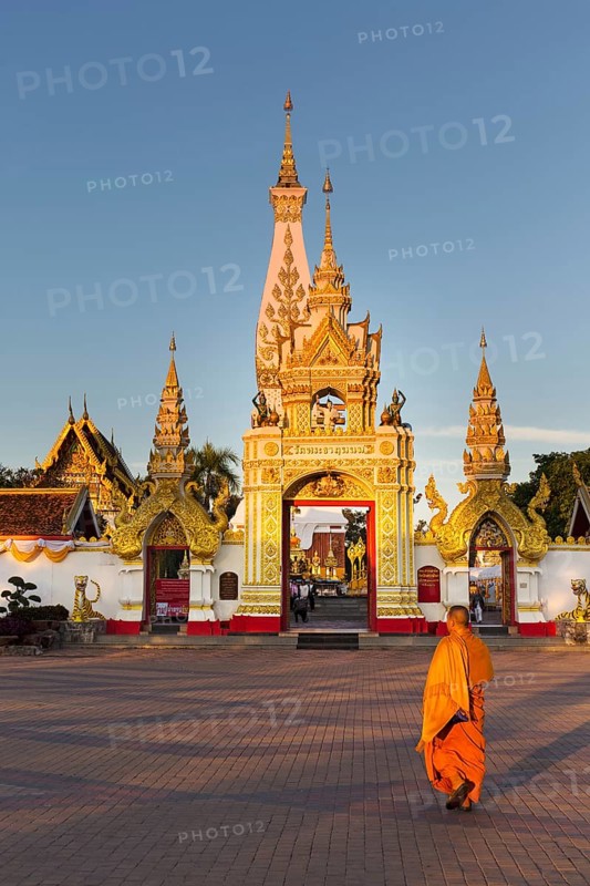 Monk in front of Chedi of Wat Phra That Phanom
