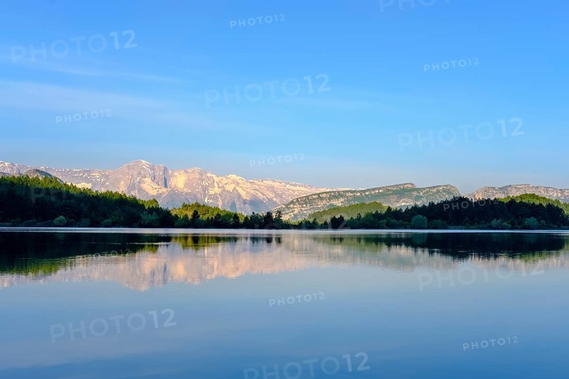 Nemercka Mountains is reflected in the lake