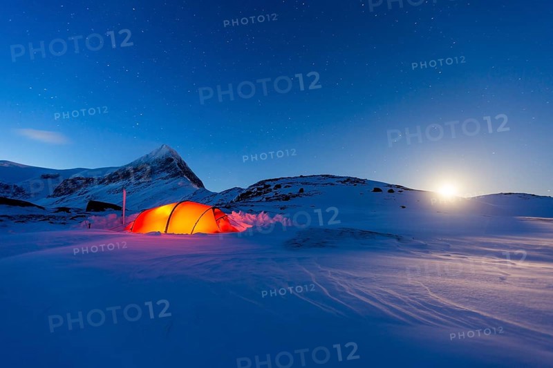Tent by full moon in the snow