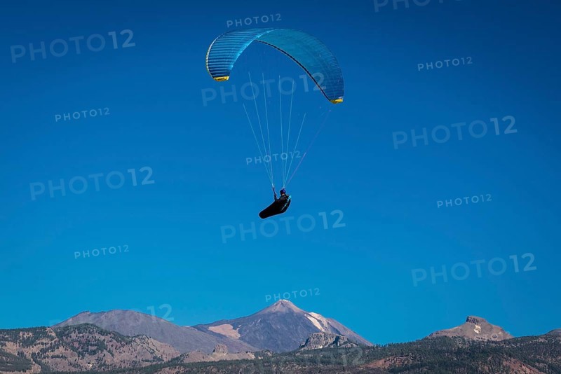 Paraglider over volcanic landscape in front of the Teide