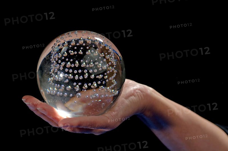 Glass ball in a woman's hand