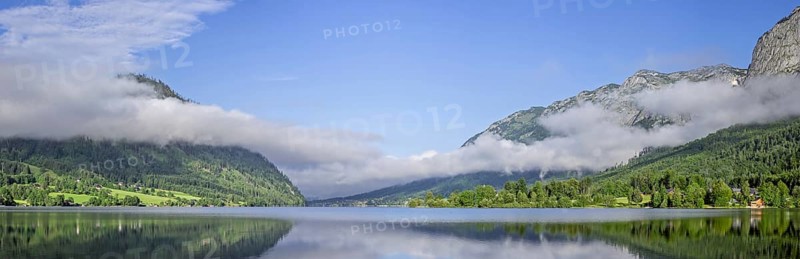 Panoramic view over the Grundlsee with low clouds