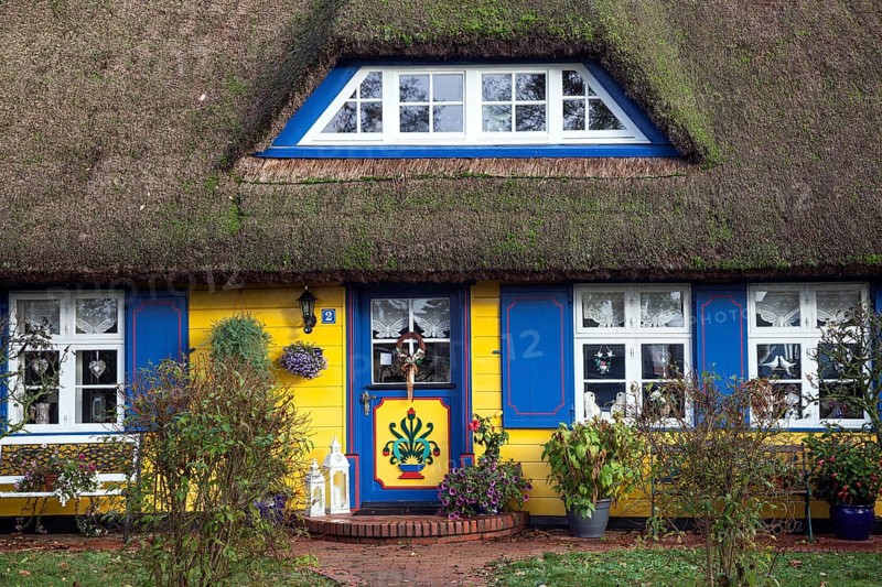 Typical yellow thatched-roof house